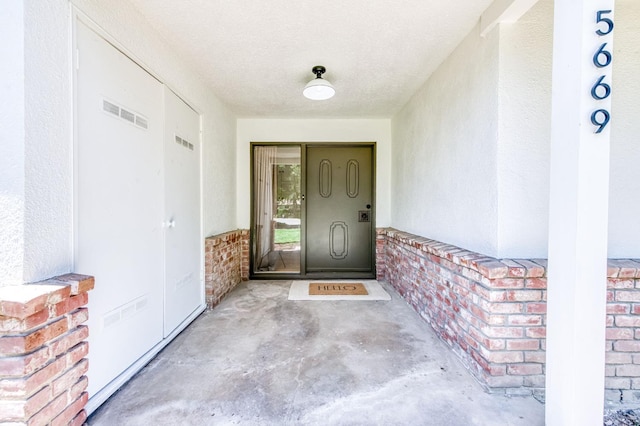 5669 N Arthur Ave, Fresno, CA 93711 - doorway to property featuring stucco siding