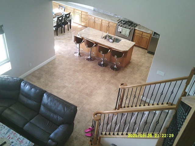 3030 Golf Dr W, Chowchilla, CA 93610 - living room with baseboards, stairway, and light tile patterned flooring