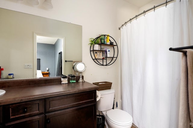 2326 W Flagstaff, Visalia, CA 93291 - full bathroom with vanity, toilet, and a shower with shower curtain