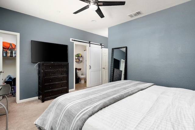 2326 W Flagstaff, Visalia, CA 93291 - carpeted bedroom with a barn door, baseboards, and ceiling fan