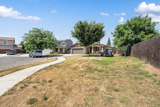 2326 W Flagstaff, Visalia, CA 93291 - view of yard featuring a garage and driveway
