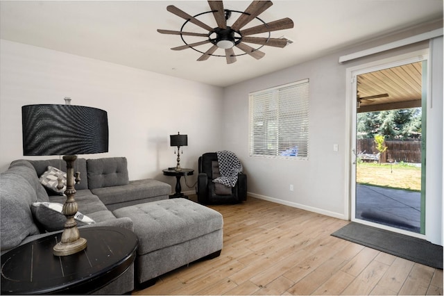 2326 W Flagstaff, Visalia, CA 93291 - living room featuring ceiling fan, baseboards, and light wood-style floors