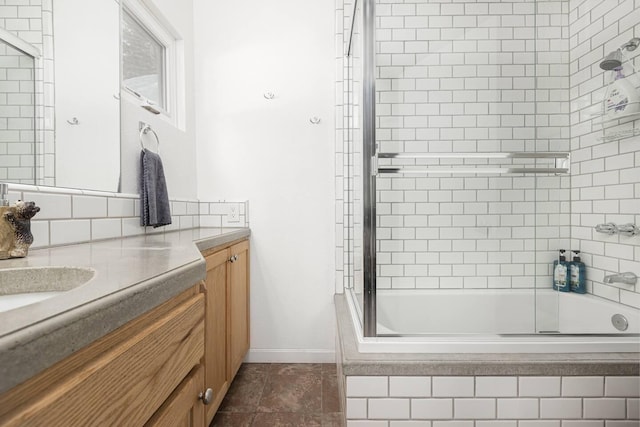 56981 Sequoia Dr, Springville, CA 93265 - bathroom with vanity, tiled shower / bath combo, tasteful backsplash, and baseboards