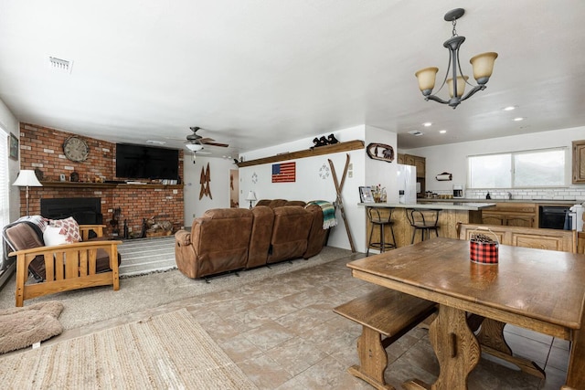 56981 Sequoia Dr, Springville, CA 93265 - dining area featuring ceiling fan, a chandelier, recessed lighting, and a fireplace