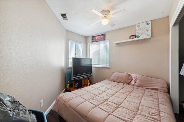 3591 W Harvard Ave, Fresno, CA 93722 - bedroom featuring baseboards, ceiling fan, and wood finished floors