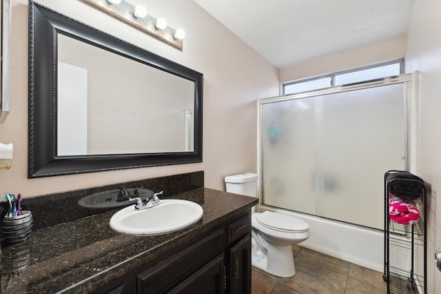 3591 W Harvard Ave, Fresno, CA 93722 - full bathroom with vanity, toilet, and combined bath / shower with glass door