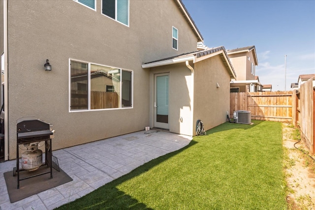 6618 E Grant Ave, Fresno, CA 93727 - back of house with stucco siding, a patio area, and cooling unit