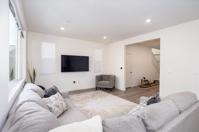 6618 E Grant Ave, Fresno, CA 93727 - living room with light wood-style floors, recessed lighting, stairway, and baseboards