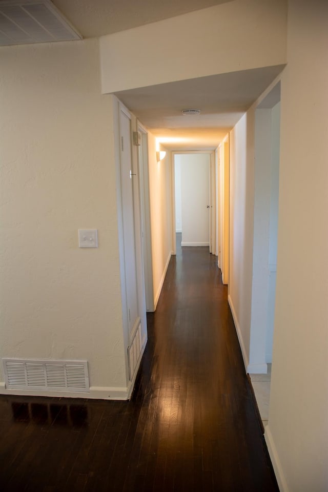 1913 N Waukena Way, Hanford, CA 93230 - hallway featuring dark wood-style floors and baseboards