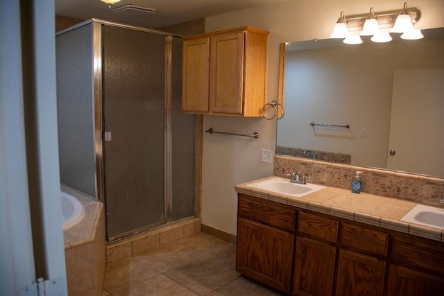 1913 N Waukena Way, Hanford, CA 93230 - full bathroom with a stall shower, tile patterned flooring, a bath, and double vanity