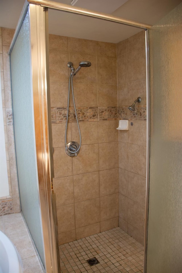 1913 N Waukena Way, Hanford, CA 93230 - bathroom featuring a shower stall and tile patterned flooring