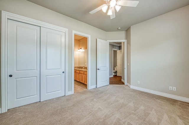 47307 Sunshine Terrace Dr, Coarsegold, CA 93614 - unfurnished bedroom featuring light carpet, a closet, baseboards, ensuite bath, and a ceiling fan