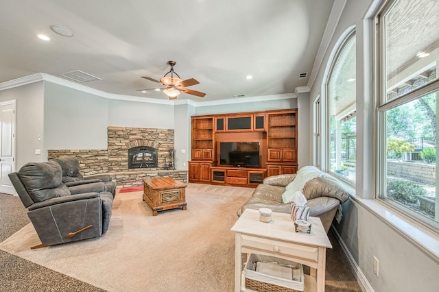 47307 Sunshine Terrace Dr, Coarsegold, CA 93614 - carpeted living area featuring recessed lighting, a ceiling fan, crown molding, baseboards, and a stone fireplace