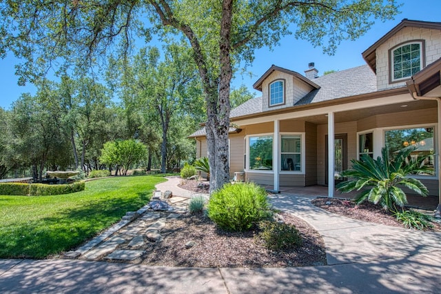 47307 Sunshine Terrace Dr, Coarsegold, CA 93614 - view of home's exterior featuring a yard, a chimney, and roof with shingles