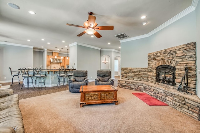 47307 Sunshine Terrace Dr, Coarsegold, CA 93614 - carpeted living room featuring a ceiling fan, ornamental molding, recessed lighting, arched walkways, and baseboards