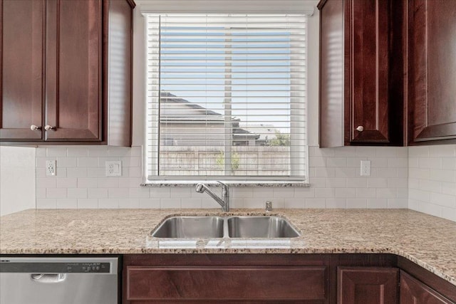 1799 Bolton Ave, Tulare, CA 93274 - kitchen featuring dishwasher, a sink, dark brown cabinetry, and decorative backsplash