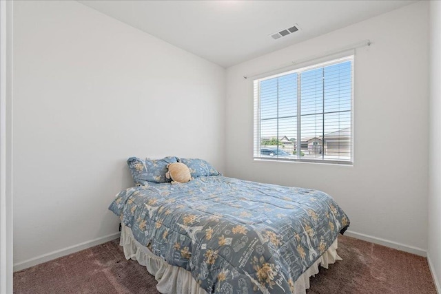 1799 Bolton Ave, Tulare, CA 93274 - carpeted bedroom with multiple windows and baseboards