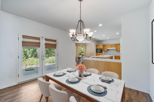 5422 W Calimyrna Ave, Fresno, CA 93722 - dining space with baseboards, dark wood-type flooring, recessed lighting, and a chandelier