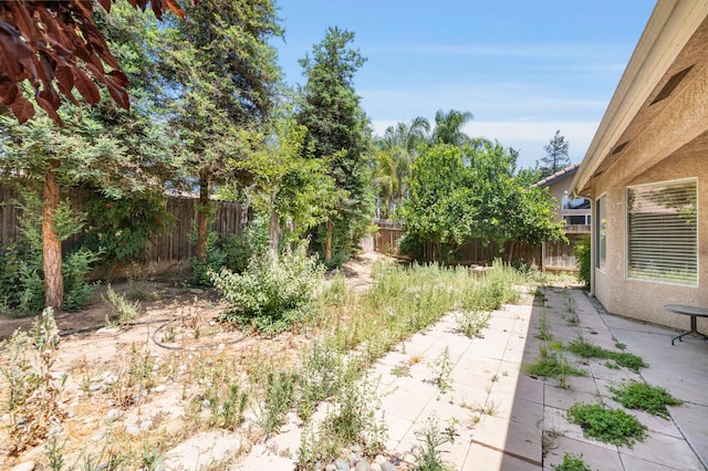 5422 W Calimyrna Ave, Fresno, CA 93722 - fenced backyard featuring a patio