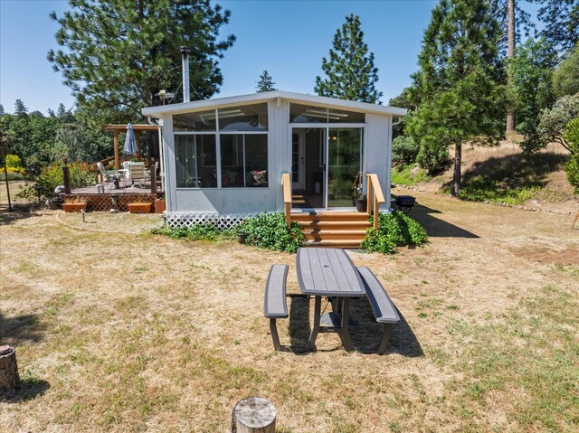 34133 Keller Rd, North Fork, CA 93643 - back of property with a sunroom, a yard, and a wooden deck