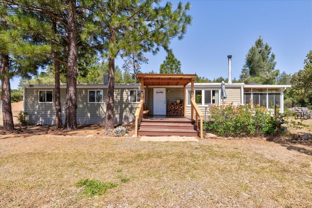 34133 Keller Rd, North Fork, CA 93643 - view of front of property with a front yard and a sunroom