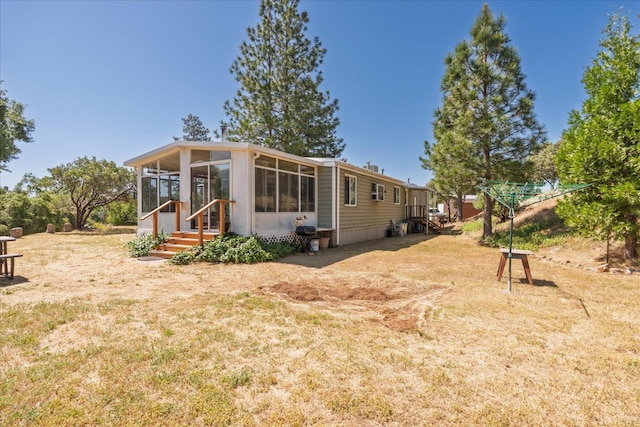 34133 Keller Rd, North Fork, CA 93643 - back of property featuring a sunroom and a yard