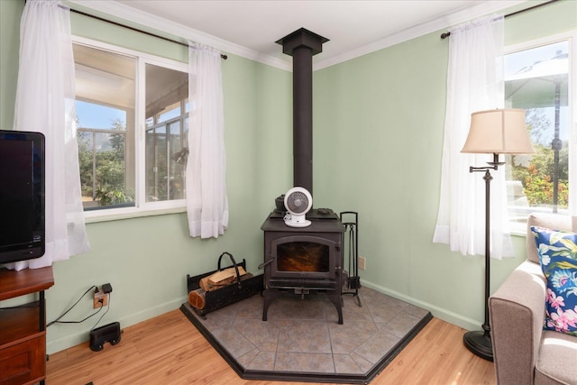 34133 Keller Rd, North Fork, CA 93643 - detailed view of a wood stove, wood finished floors, and ornamental molding