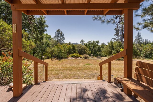 34133 Keller Rd, North Fork, CA 93643 - wooden deck featuring a lawn and view of scattered trees