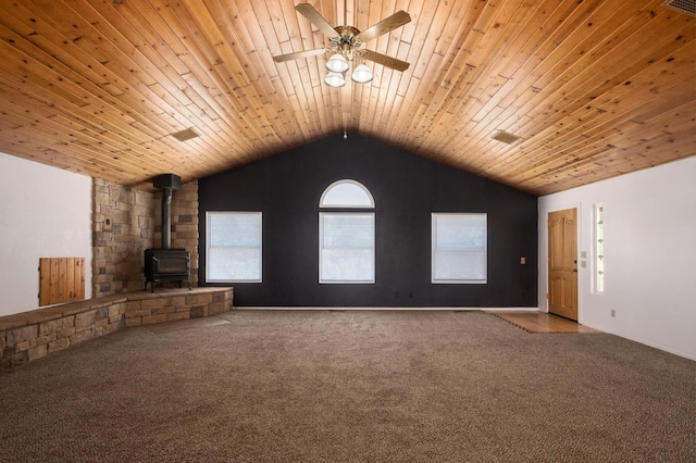 37667 Eagle Dr, Raymond, CA 93653 - unfurnished living room with a wood stove, carpet, vaulted ceiling, ceiling fan, and wooden ceiling