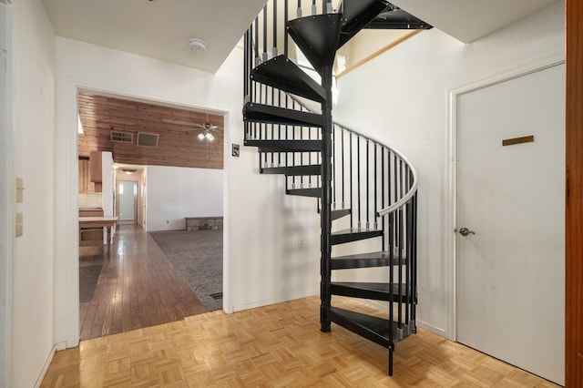 37667 Eagle Dr, Raymond, CA 93653 - stairs with a ceiling fan, parquet flooring, and baseboards