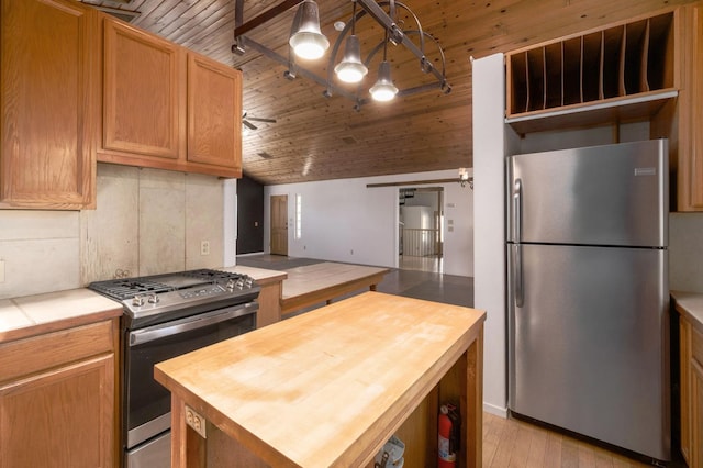 37667 Eagle Dr, Raymond, CA 93653 - kitchen with appliances with stainless steel finishes, butcher block counters, open shelves, wood ceiling, and a kitchen island