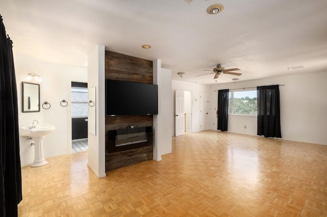 37667 Eagle Dr, Raymond, CA 93653 - unfurnished living room featuring ceiling fan and baseboards
