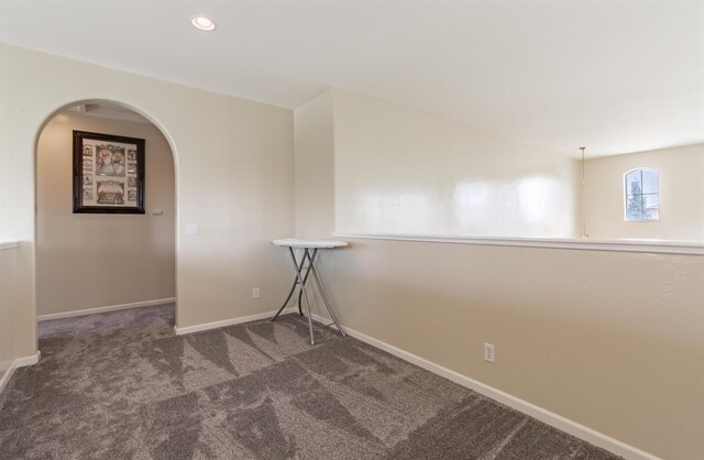 7026 E Dayton Ave, Fresno, CA 93737 - carpeted empty room with arched walkways, baseboards, and recessed lighting