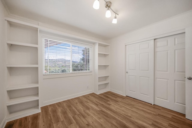 44719 Savage Rd, Coarsegold, CA 93614 - unfurnished bedroom featuring wood finished floors, a closet, and baseboards