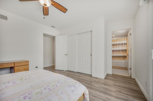 44719 Savage Rd, Coarsegold, CA 93614 - bedroom featuring wood finished floors, a closet, ensuite bath, baseboards, and ceiling fan