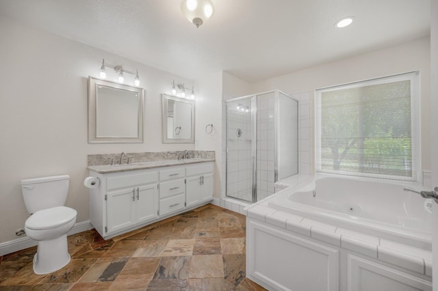 44719 Savage Rd, Coarsegold, CA 93614 - bathroom featuring double vanity, a stall shower, a tub with jets, toilet, and stone finish flooring