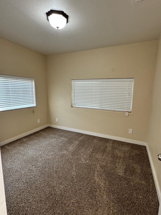 1382 N Thorne Ave, Fresno, CA 93728 - carpeted empty room featuring a textured ceiling and baseboards