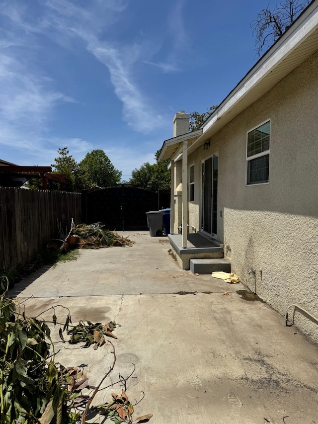 1382 N Thorne Ave, Fresno, CA 93728 - fenced backyard with a patio area