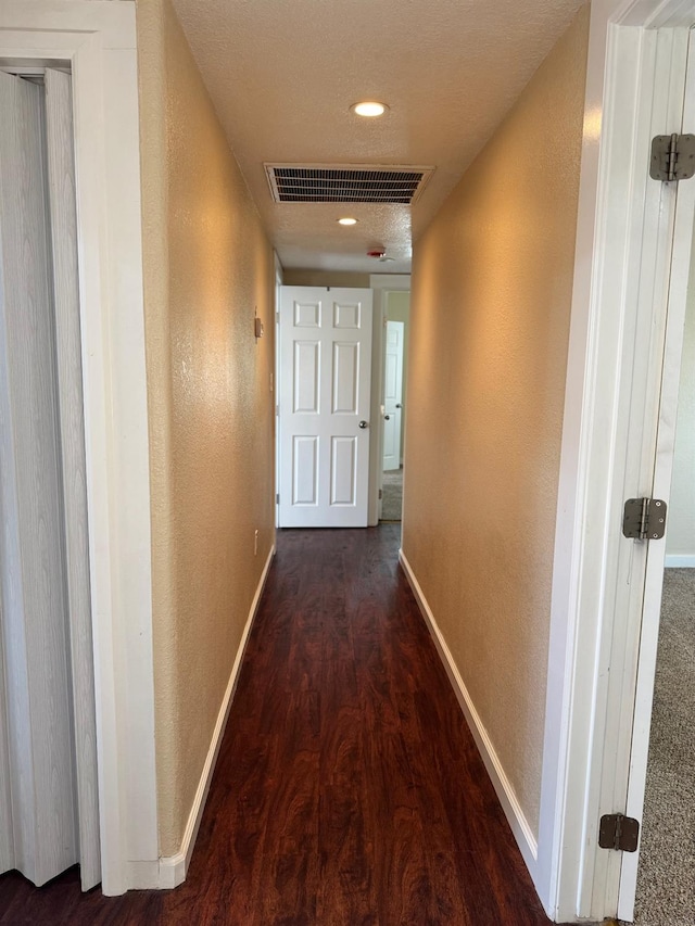 1382 N Thorne Ave, Fresno, CA 93728 - corridor featuring wood finished floors, a textured wall, baseboards, and recessed lighting