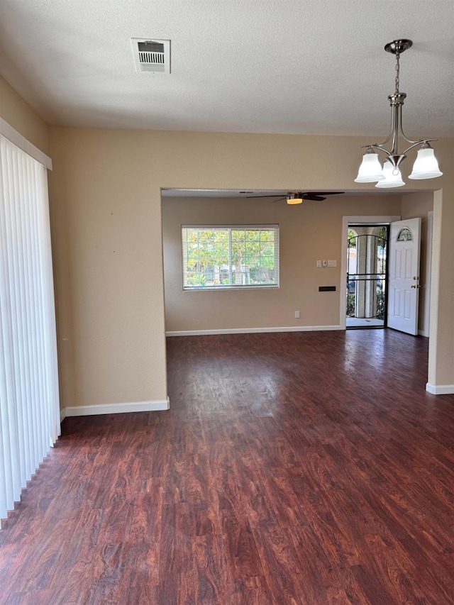 1382 N Thorne Ave, Fresno, CA 93728 - unfurnished room with wood finished floors, baseboards, and a chandelier