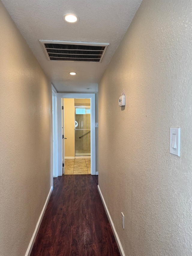 1382 N Thorne Ave, Fresno, CA 93728 - hall featuring wood finished floors, baseboards, a textured wall, and recessed lighting