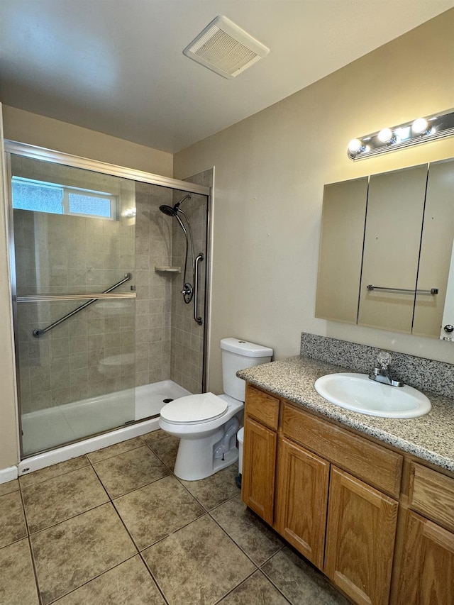1382 N Thorne Ave, Fresno, CA 93728 - bathroom with toilet, vanity, a shower stall, and tile patterned flooring