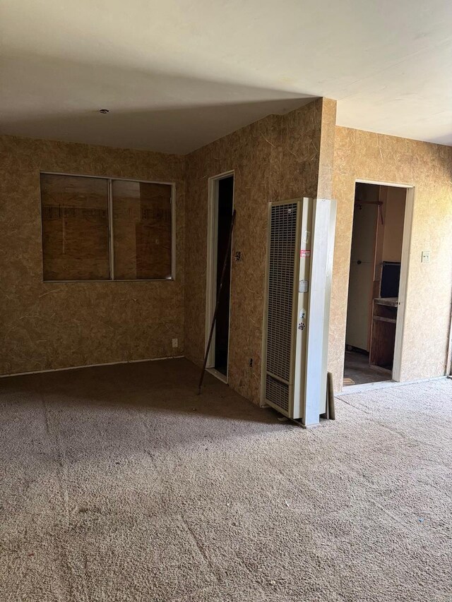1382 N Thorne Ave, Fresno, CA 93728 - carpeted empty room with a heating unit