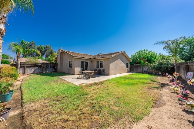 1238 La Jolla Way, Madera, CA 93638 - rear view of house with stucco siding and a patio