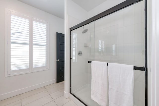 2867 E Tamarind Dr, Fresno, CA 93730 - bathroom featuring plenty of natural light, tile patterned floors, and a shower stall