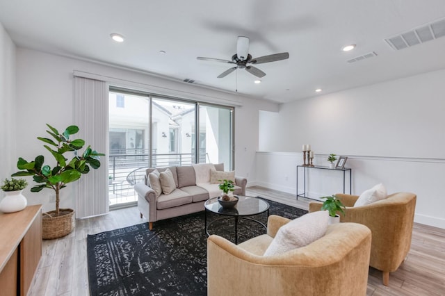 2867 E Tamarind Dr, Fresno, CA 93730 - living room with ceiling fan, light wood-style floors, baseboards, and recessed lighting