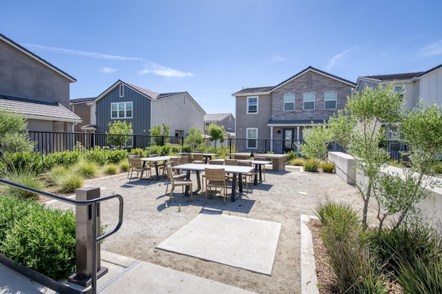 2867 E Tamarind Dr, Fresno, CA 93730 - view of community featuring a patio, outdoor dining space, and a residential view