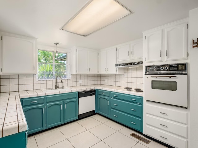 1646 W Millbrae Ave, Fresno, CA 93711 - kitchen with white appliances, a sink, and white cabinets