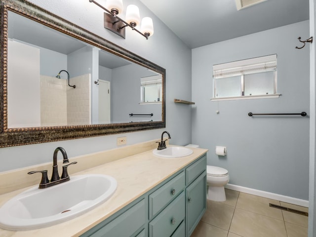 1646 W Millbrae Ave, Fresno, CA 93711 - full bath featuring double vanity, toilet, tile patterned floors, a shower, and baseboards
