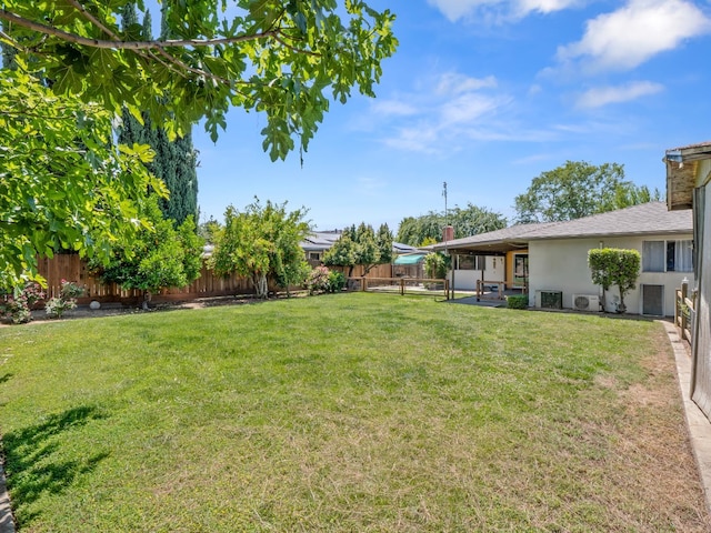1646 W Millbrae Ave, Fresno, CA 93711 - view of yard with central AC unit and a patio